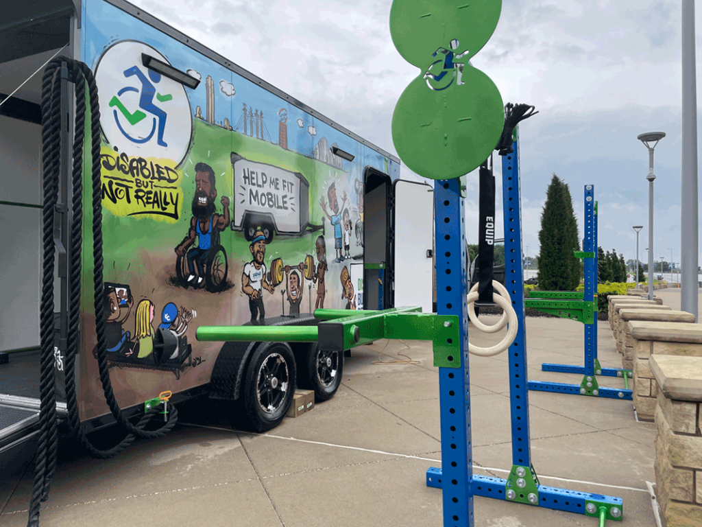 DBNR #HelpMeFIt van with inclusive and adaptive workout equipment and a colorful mural on the side of the van.