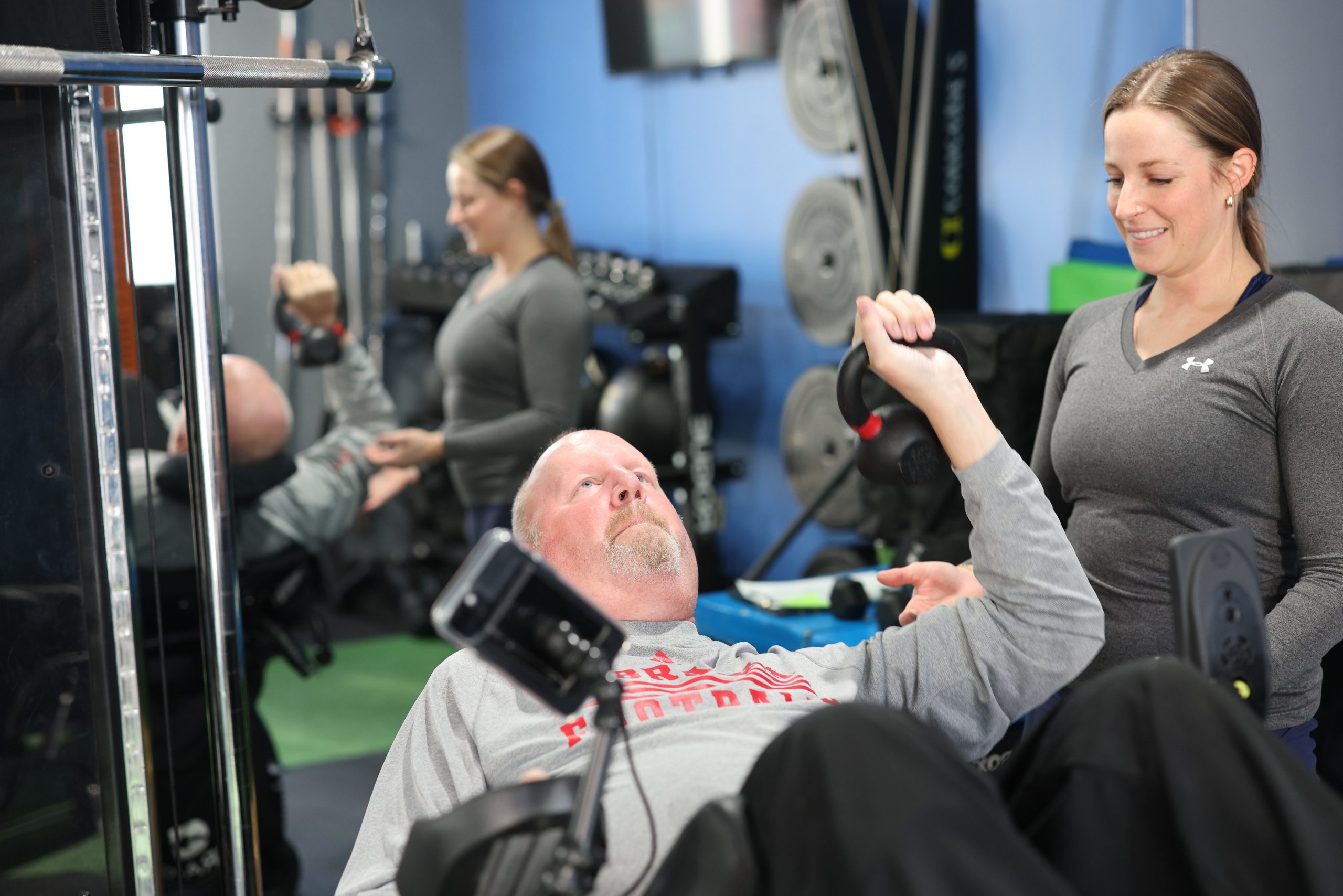 DBNR participant training on an adaptive cable machine